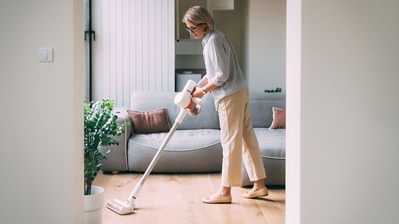Woman vacuuming Scottsdale Dust